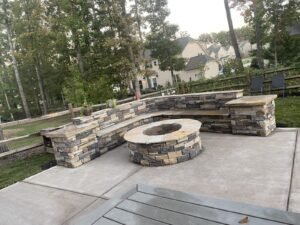 d and l landscaped backyard with fireplace